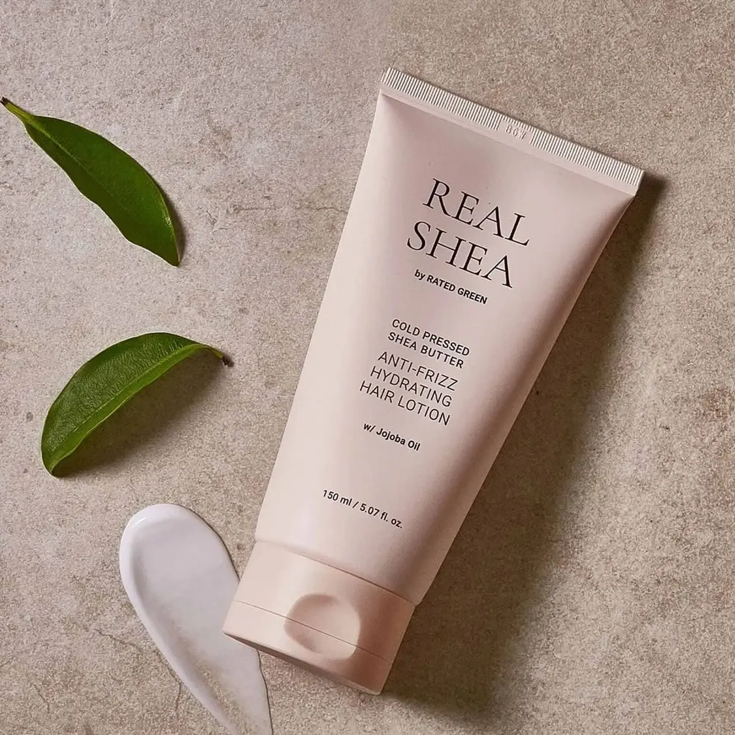Loțiune împotriva firelor ne-ascultătoare Rated Green Cold Pressed Shea Butter Anti-Frizz Hair Lotion 150ml