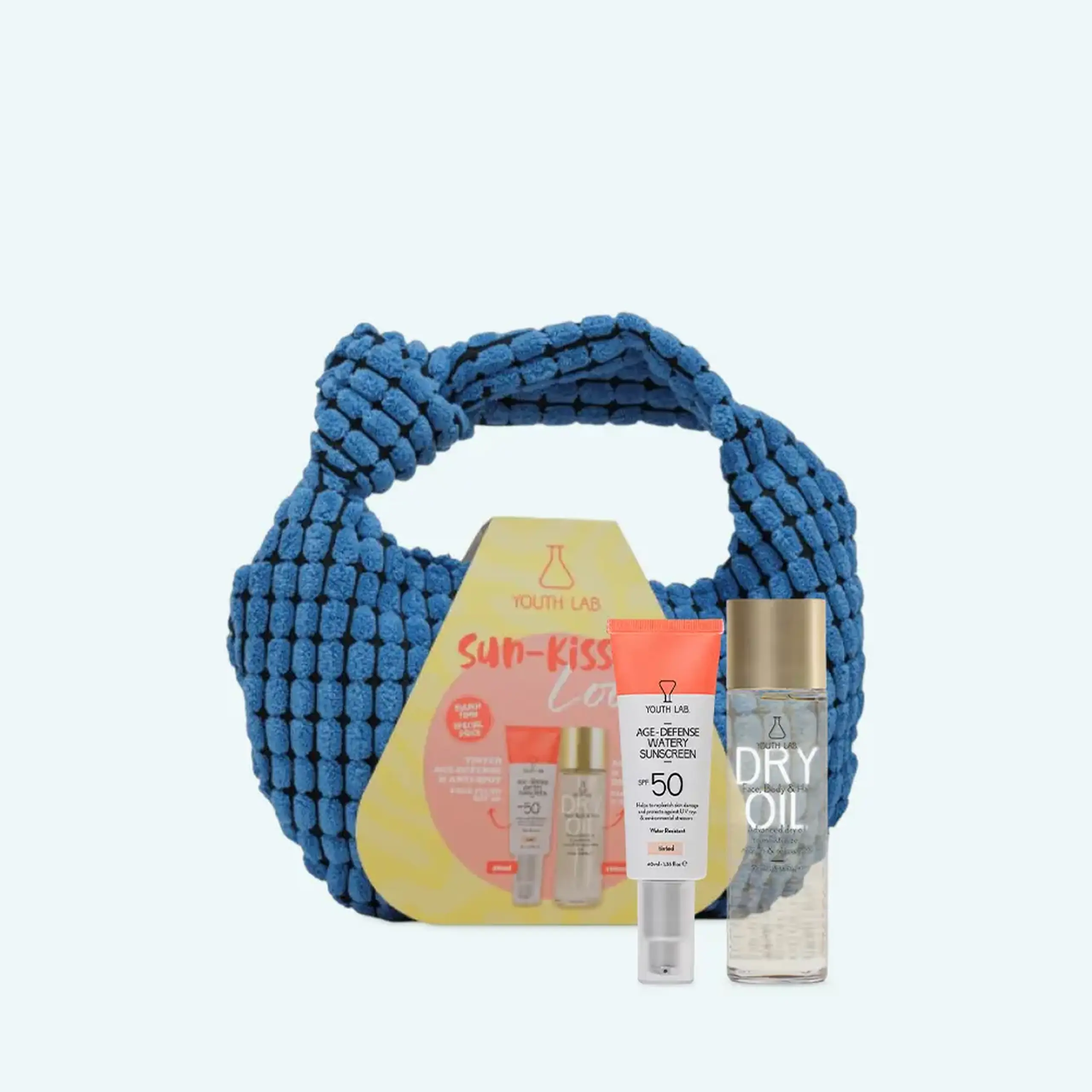 Ser protecție solară SUMMER SET 2026 VALUE SET BLUE POUCH- AGE DEFENSE TINTED & DRY OIL