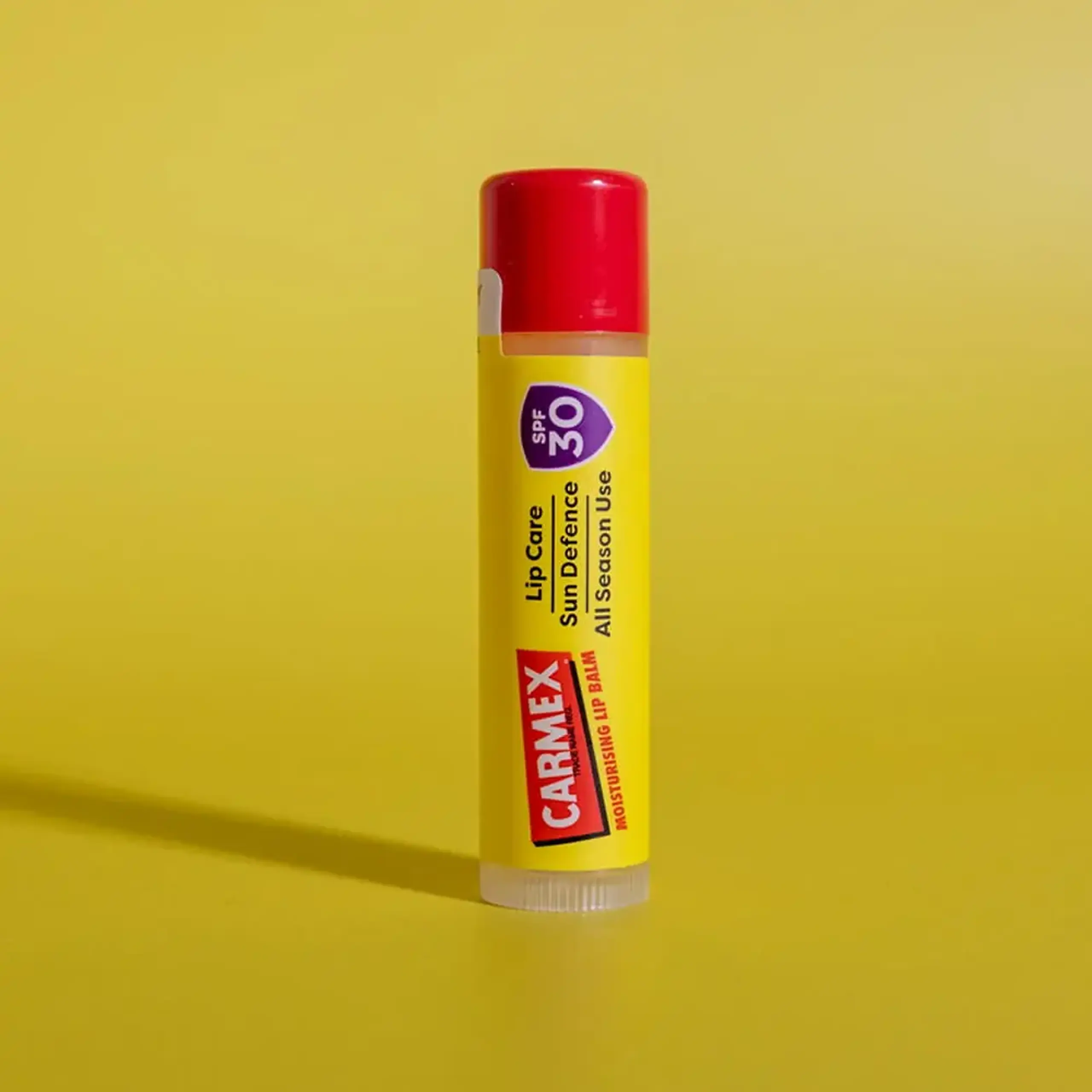 Balsam buze CARMEX Stick Sun Defense Tropical SPF 30